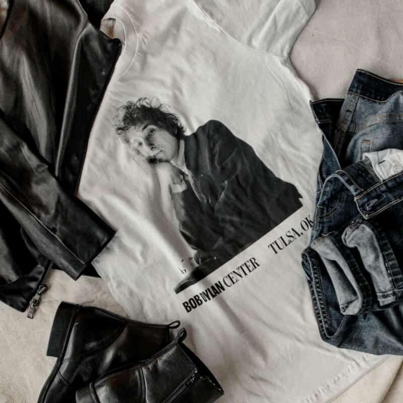 Bob Dylan Center merchandise laid out on a table, including a T-shirt.