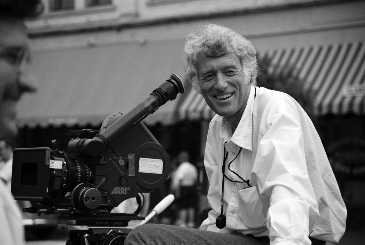 Cinematographer Roger Deakins next to a cinema camera