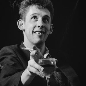 Shane with Glass and Cigarette. The Pogues, Liverpool. Photo by Andrew Catlin.